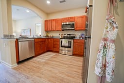 Modern kitchen with wood cabinets and stainless appliances