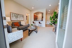 Modern living room with open kitchen and bar stools