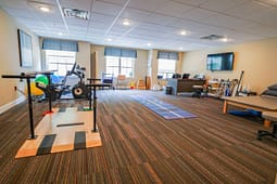 Physical therapy room with exercise and rehab equipment