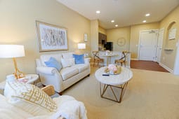 Cozy staged living room with small dining area