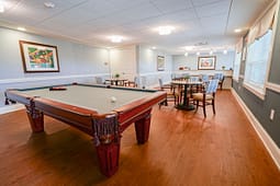 Recreation room with pool table and seating area