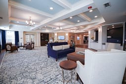 Elegant community lobby with sofas and chandeliers