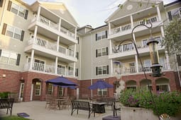 Apartment courtyard with balconies and patio seating