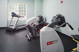 Small gym room with cardio exercise equipment
