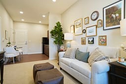 Cozy living room with beige sofa and gallery wall