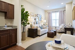 Cozy staged living room with sofa and armchair