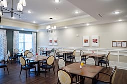 Bright modern dining room with wooden tables