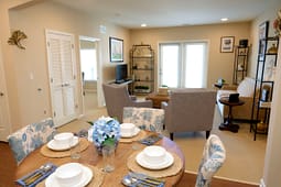 Staged apartment dining and living room interior