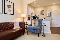 Cozy living room with leather sofa and armchair
