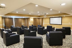 Private screening room with leather chairs and projector