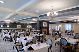 Elegant dining room with round tables and chandeliers