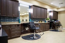 Modern hair salon with styling chairs and mirrors