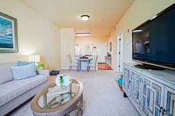 Bright living room with dining area and TV
