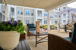 Apartment patio with Jenga game and seating