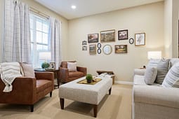 Cozy living room with leather chairs and gallery wall