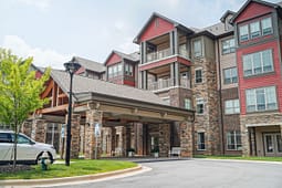 Modern apartment building with covered entrance and balconies
