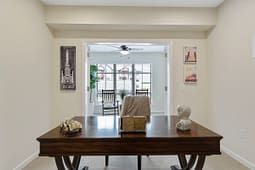 Home office with wooden desk and Chicago wall art