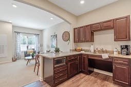 Modern kitchen with dark wood cabinets and island