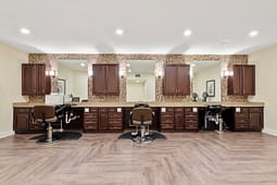 Modern salon interior with styling stations and mirrors
