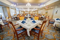 Elegant banquet hall with round tables and chandeliers