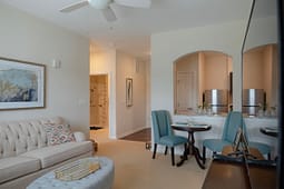 Modern apartment living and dining area with archway