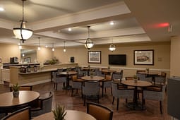 Cozy dining area with round tables and pendant lighting