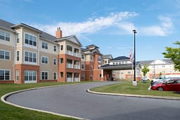 Three-story brick and siding apartment building exterior