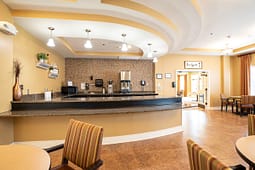 Hotel breakfast area with curved granite counter