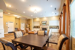 Spacious community lounge with dining and fireplace