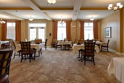 Elegant dining room with white tablecloth tables