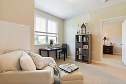 Cozy living room with desk and bookshelf