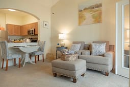 Cozy living room with armchairs and ottoman