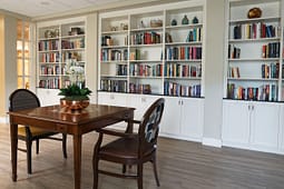 Elegant study room with bookshelves and wooden table