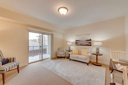 Bright living room with sofa and balcony access
