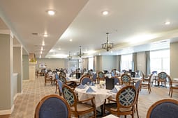 Elegant dining room with round tables and chandeliers