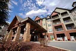 Modern apartment building with covered entrance and balconies