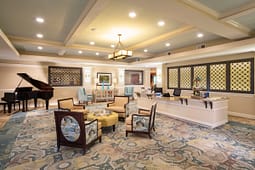 Elegant lobby with grand piano and seating area