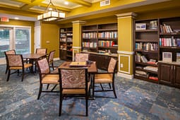 Cozy library lounge with bookshelves and reading tables