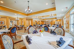 Elegant dining room with set tables and chandeliers