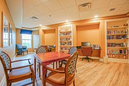 Cozy library study room with bookshelves and desks