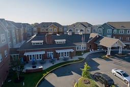 Aerial view of brick senior living community