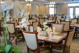 Elegant dining room with set tables and flowers