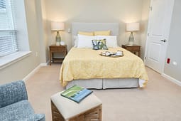 Bright bedroom with yellow bedding and nightstands