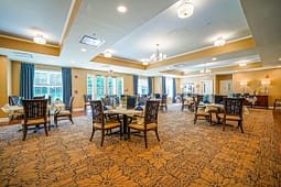 Elegant dining room with round tables and chandeliers