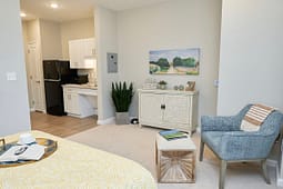 Cozy studio apartment with kitchenette and seating area