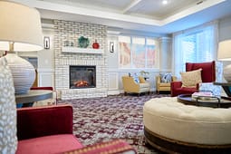 Cozy living room with white brick fireplace