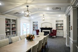 Elegant meeting room with fireplace and bookshelves