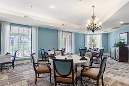 Elegant dining room with round tables and chandelier