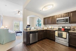 Modern kitchen with dark cabinets and stainless appliances