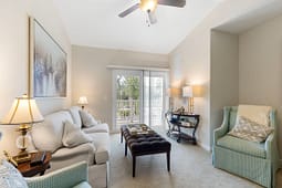 Bright living room with sofa and balcony view